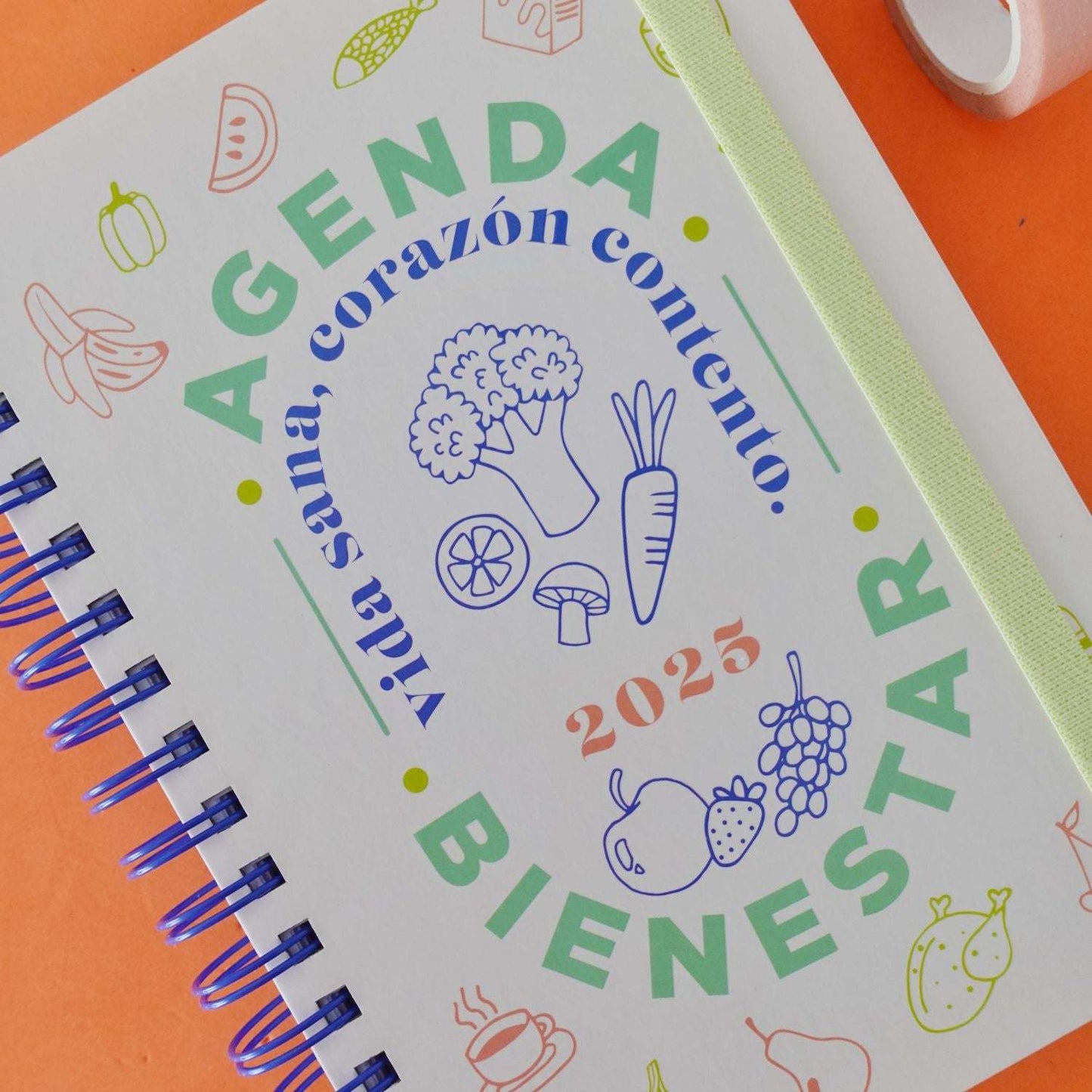 Agenda 2025 Mooving Bienestar - Daily planner with wellness focus, featuring day-per-page layout, hardcover design, and customization stickers.