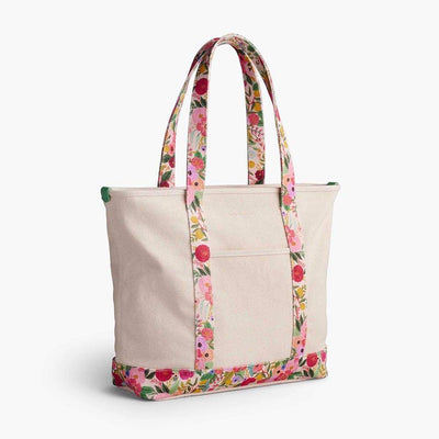 Bolso de lona Garden Party con ilustraciones florales coloridas, asas reforzadas y bolsillo interior seguro.