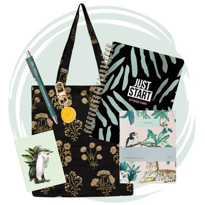 Imagine Box 02 gift set featuring floral tote bag, planner, notebook, green pen, metallic keychain, and illustrated postcard by Billy Paper.