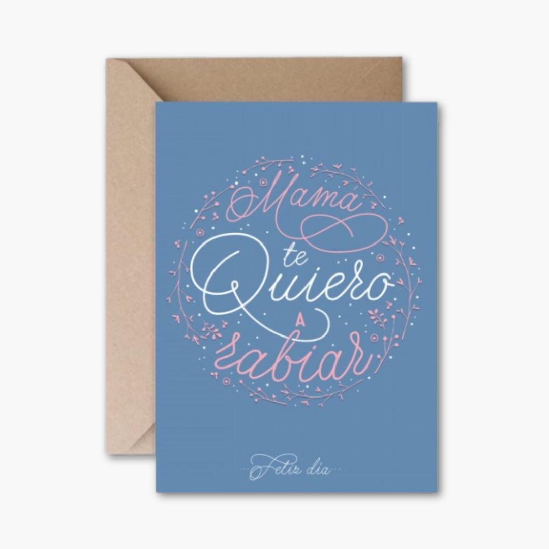 Tarjeta de felicitación "Mamá te quiero a rabiar" en papel azul con sobre kraft, tamaño A6.